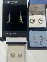 Four pairs of silver earrings