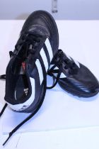 A pair of children's Adidas football shoes size 2 1/2