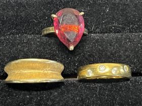 Three silver gilt rings