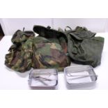A vintage British army chest rig with pouches and mess tins