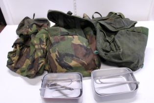 A vintage British army chest rig with pouches and mess tins