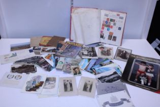 A selection of vintage ephemera including postcards and stamps etc