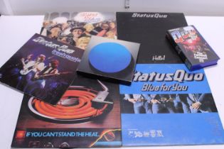 A selection of assorted Status Quo related records, tapes, and VHS