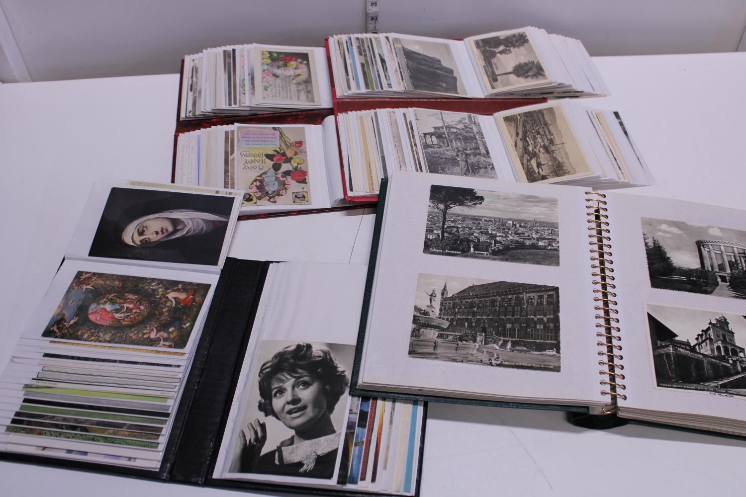 A selection of assorted postcard albums