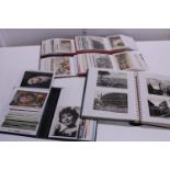 A selection of assorted postcard albums