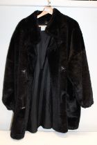A ladies House of Fraser Faux fur coat size 16