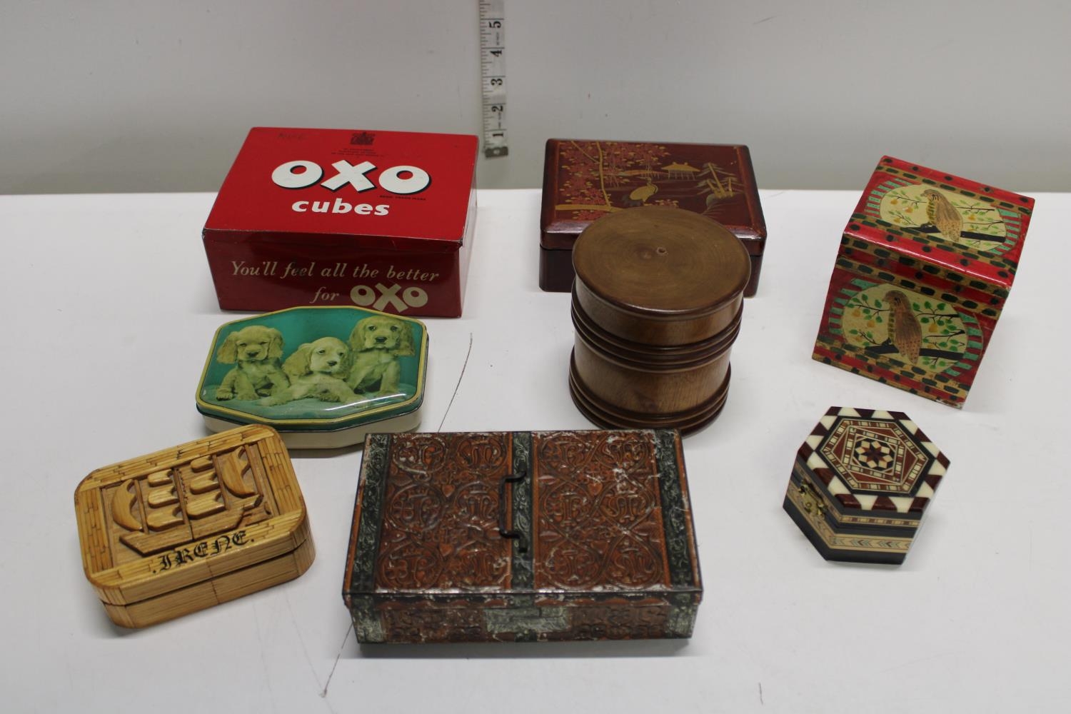A selection of vintage tins and treen items