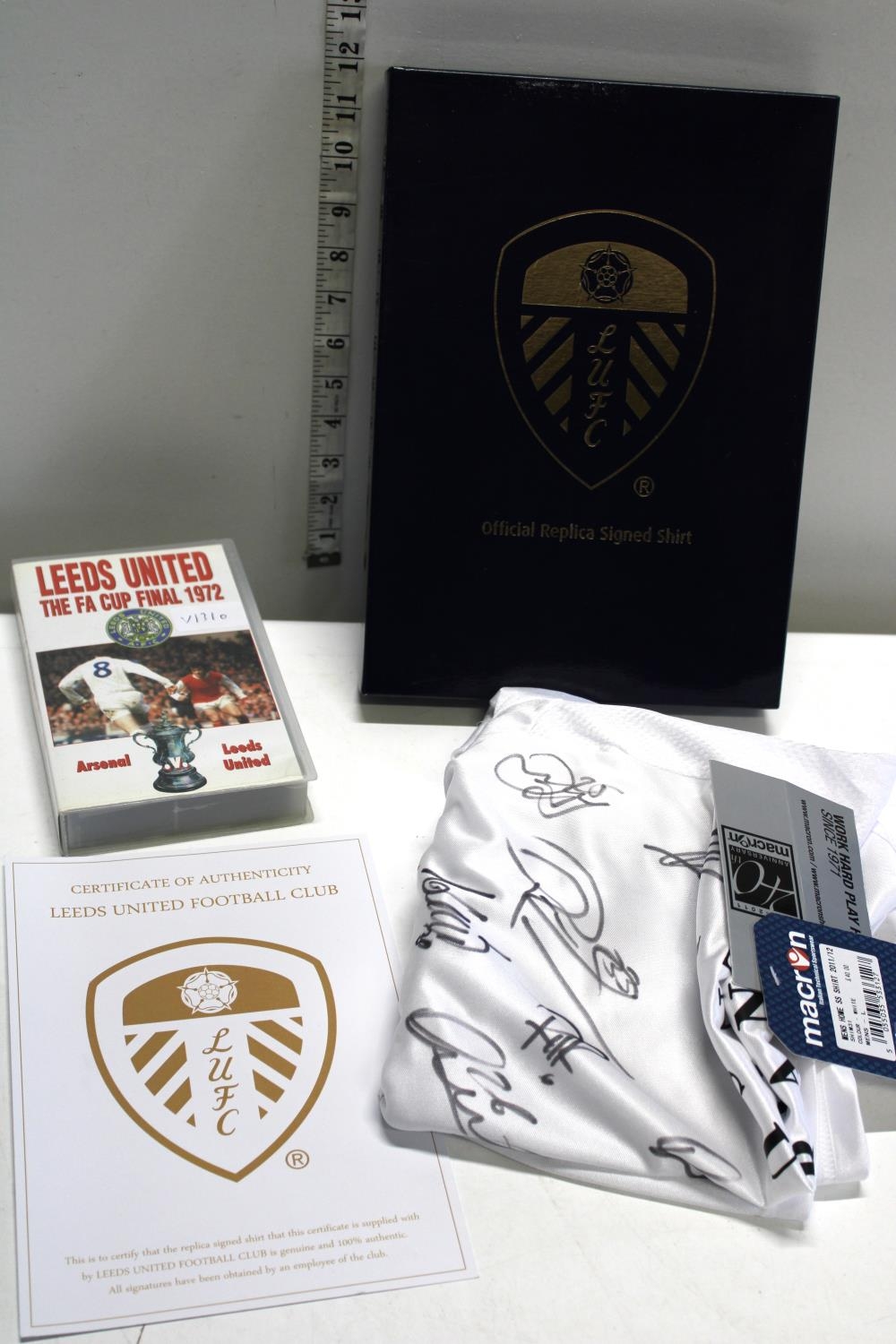 A Leeds United 1972 FA cup final VHS and a Leeds United replica football shirts with COA