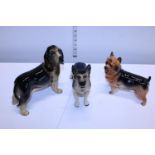 Three Cooper craft ceramic dog figures