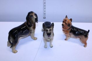 Three Cooper craft ceramic dog figures