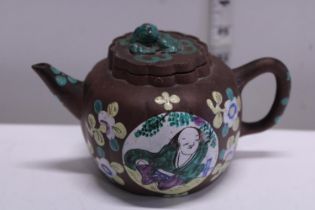 A vintage Chinese terracotta teapot with character marks to base and applied enamel decoration