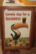 A large framed Guinness poster, shipping unavailable
