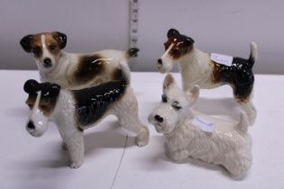 Four Cooper craft ceramic dog figures