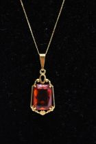 A 9ct gold chain and pendant with amber stone gross weight 2.58g