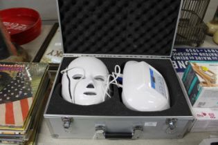 A boxed electronic beauty face mask (untested)