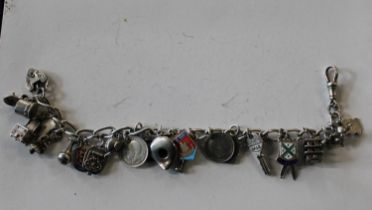 A silver charm bracelet and pendants