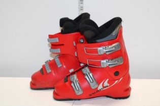 A pair of children's red ski boots