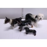 Four Cooper craft ceramic dog figures