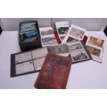 A job lot of assorted vintage postcards and albums etc