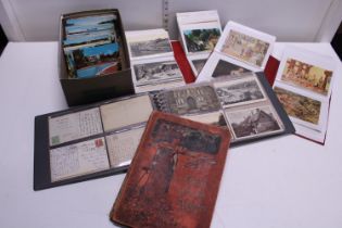 A job lot of assorted vintage postcards and albums etc