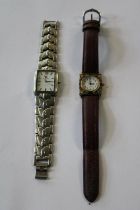 A swiss stainless steel men's watch and a ladies watch with enamel decoration