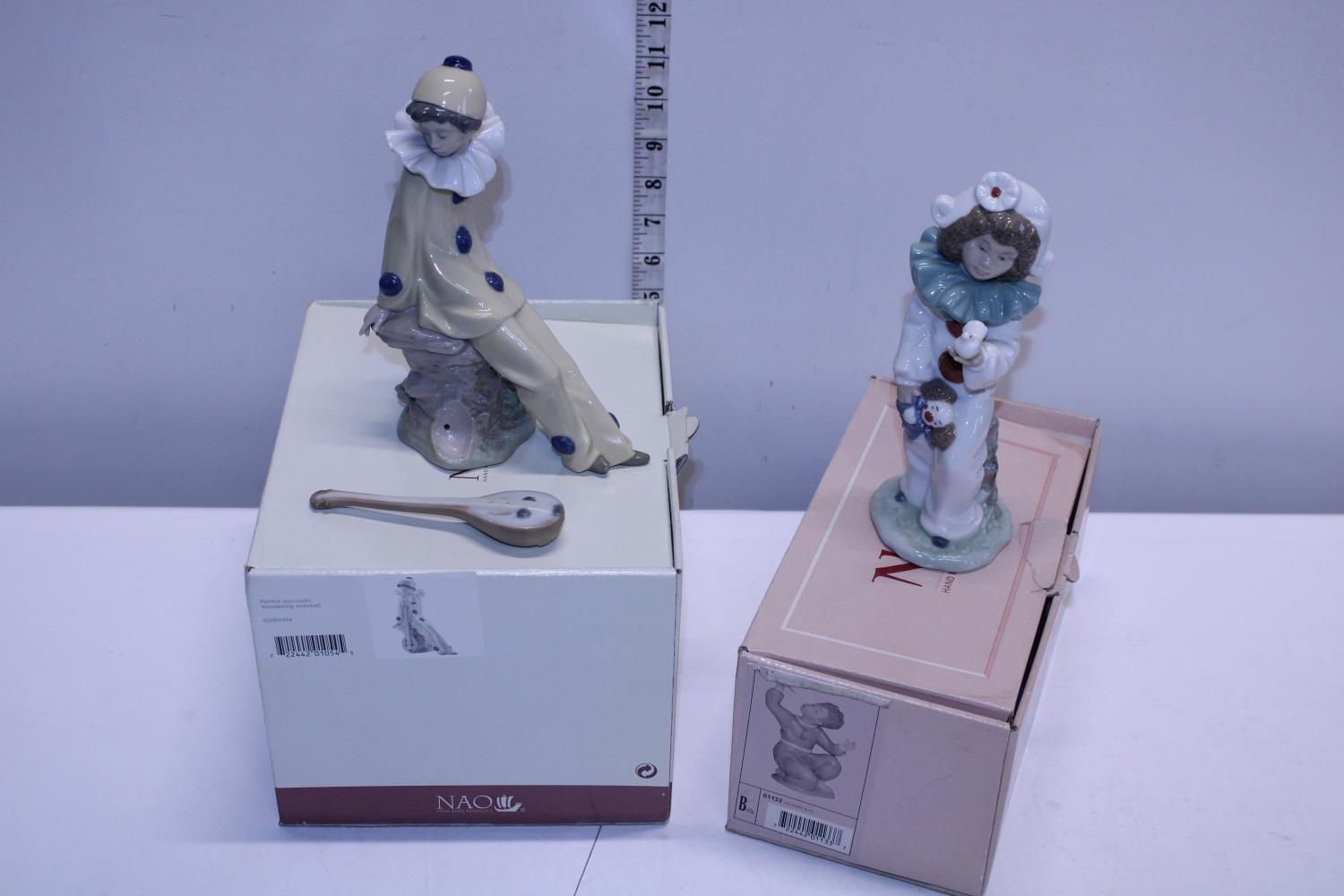 Two boxed Nao figurines