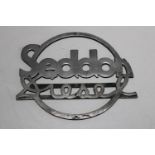 A vintage Sedan diesel truck badge