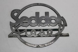 A vintage Sedan diesel truck badge