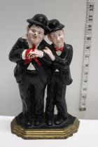 A cast iron Laurel and Hardy doorstop