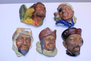 A selection of Boson's and other wall hanging figurines