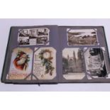 A antique postcard album with good selection of assorted postcards