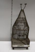 A unusual metal birdcage 65cm tall, shipping unavailable