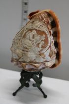 A antique carved shell lamp