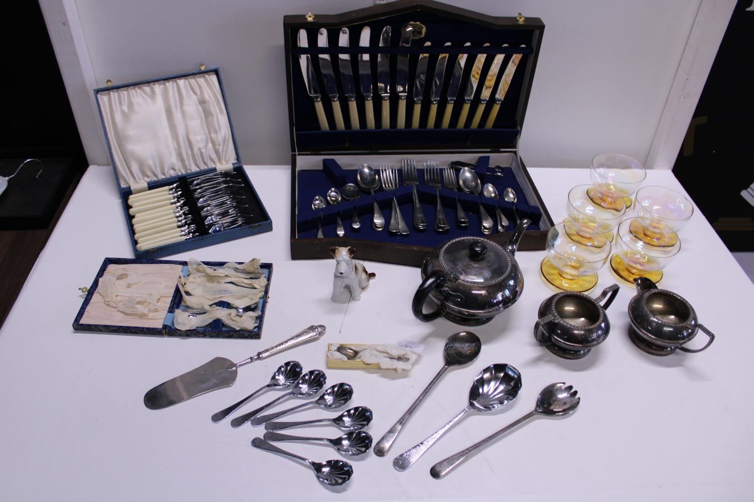 A job lot of assorted collectables including flatware, cutlery etc