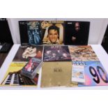 A selection of assorted LP records and VHS music related tapes