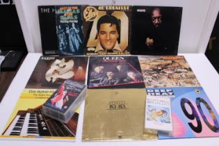 A selection of assorted LP records and VHS music related tapes