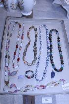 A job lot of assorted agate and coloured stone necklaces and other