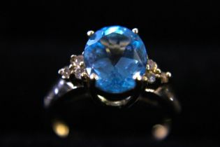 A 10ct gold & 2.17ct natural blue topaz & diamond cocktail ring.