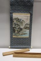 A Oriental landscape wall scroll in original wooden case