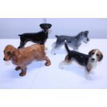 Four Cooper craft ceramic dog figures