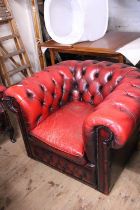 A vintage leather chesterfield tub chair in oxblood. Good condition with general ware and tear. No