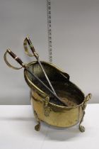 A antique brass coal bucket and fire irons, shipping unavailable