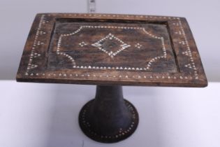 A early 20th century Indonesian offering stand from Lombok Island inlaid with shell and coin