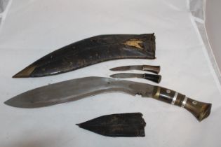 A Kukri knife in scabbard (scabbard a/f)