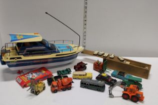 A vintage Nikko remote control boat and selection of die-cast models