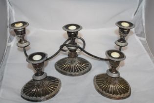A selection of silver plated candlesticks