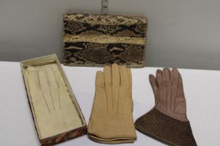 A selection of vintage ladies gloves and a snakeskin purse