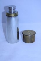 A unusual cartridge shaped hip flask