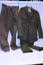 A pair of battle dress trousers and a military uniform