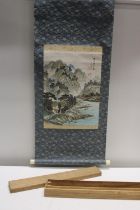 A large Oriental landscape wall scroll in original wooden case